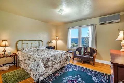 a bedroom with bed and a couch