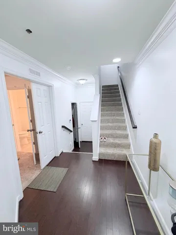 a view of entryway with wooden floor