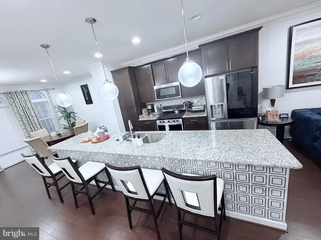 a kitchen with a table and chairs in it