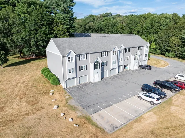 a view of a house with swimming pool and sitting area