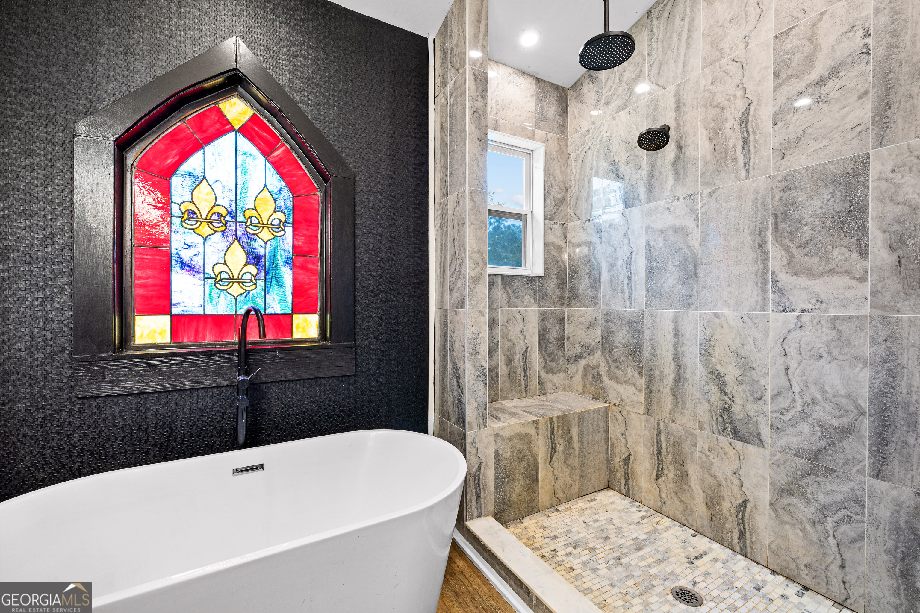 1329 Standing Rock Road Senoia, GA 30276 - Photo 19 of 77 a bathroom with a bathtub and a shower