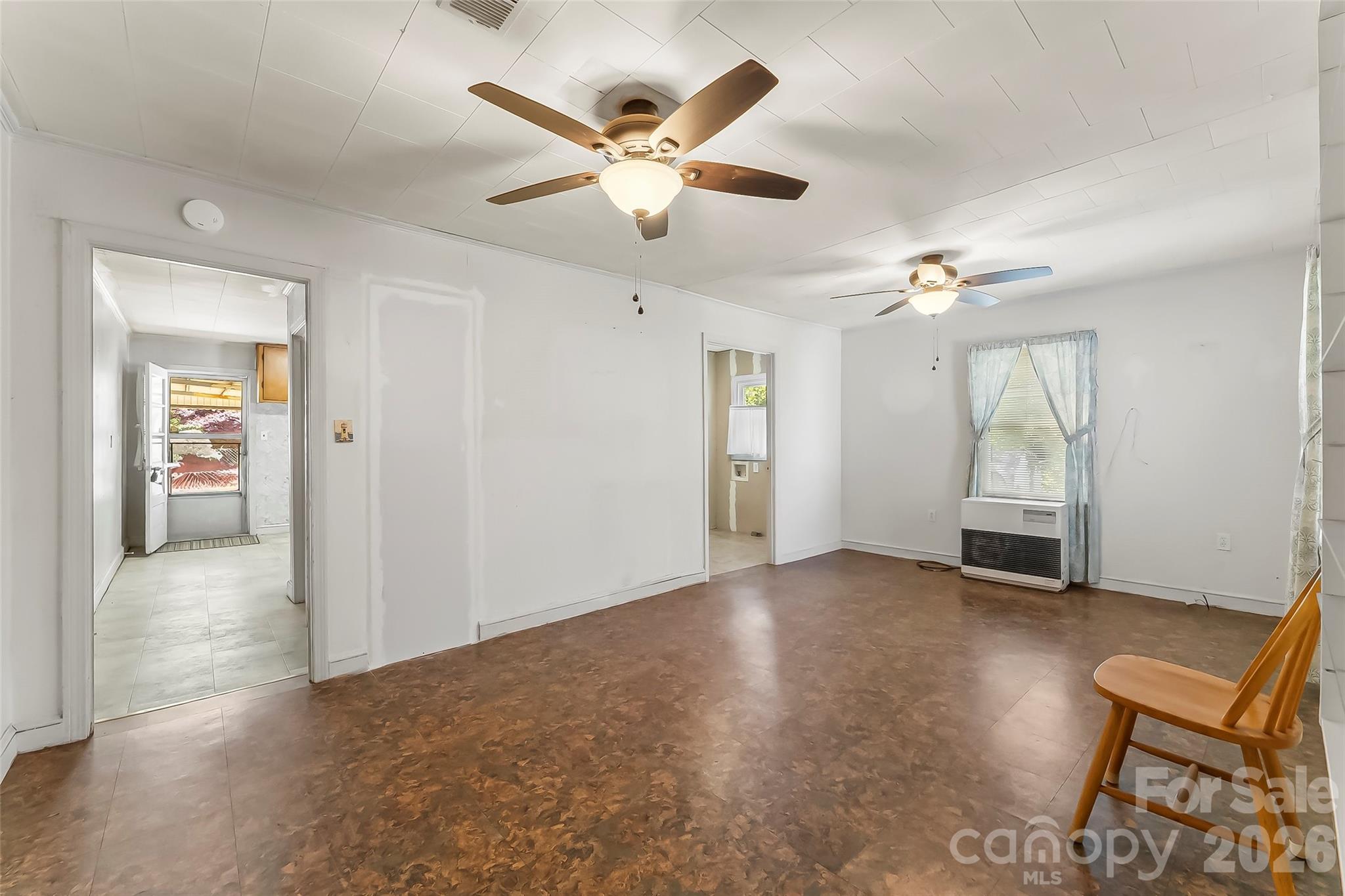 428 Melrose Street Southwest Lenoir, NC 28645 - Photo 12 of 34 an empty room with fan and windows