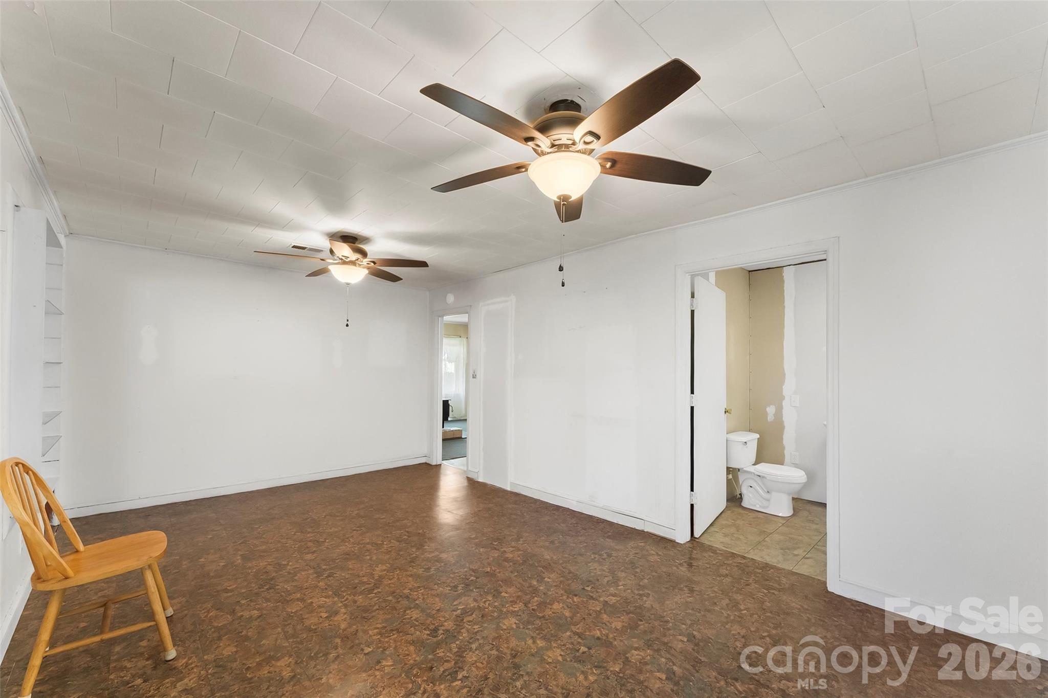 428 Melrose Street Southwest Lenoir, NC 28645 - Photo 13 of 34 a view of an empty room and wooden floor