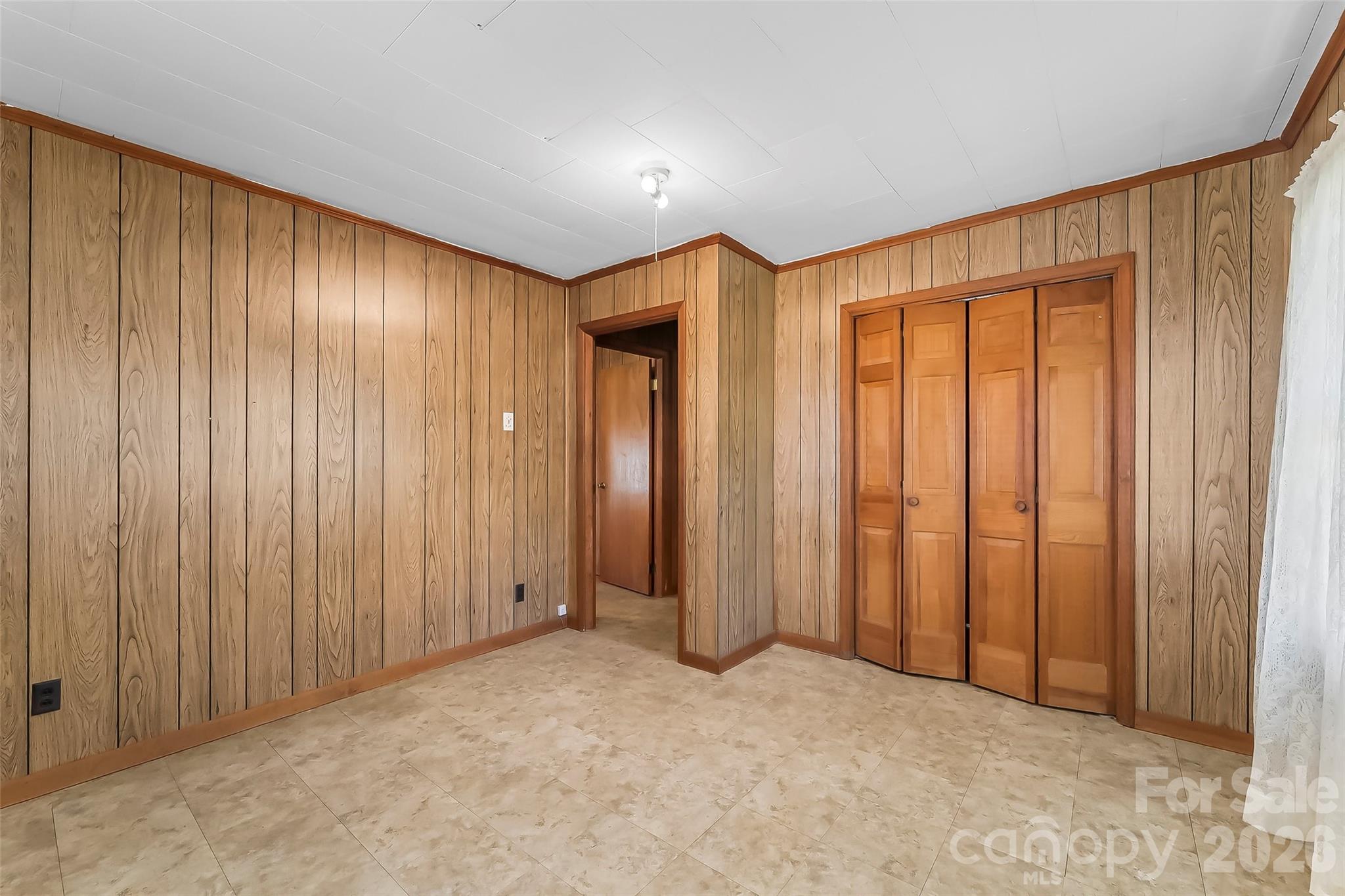 428 Melrose Street Southwest Lenoir, NC 28645 - Photo 15 of 34 an empty room with a wooden walls