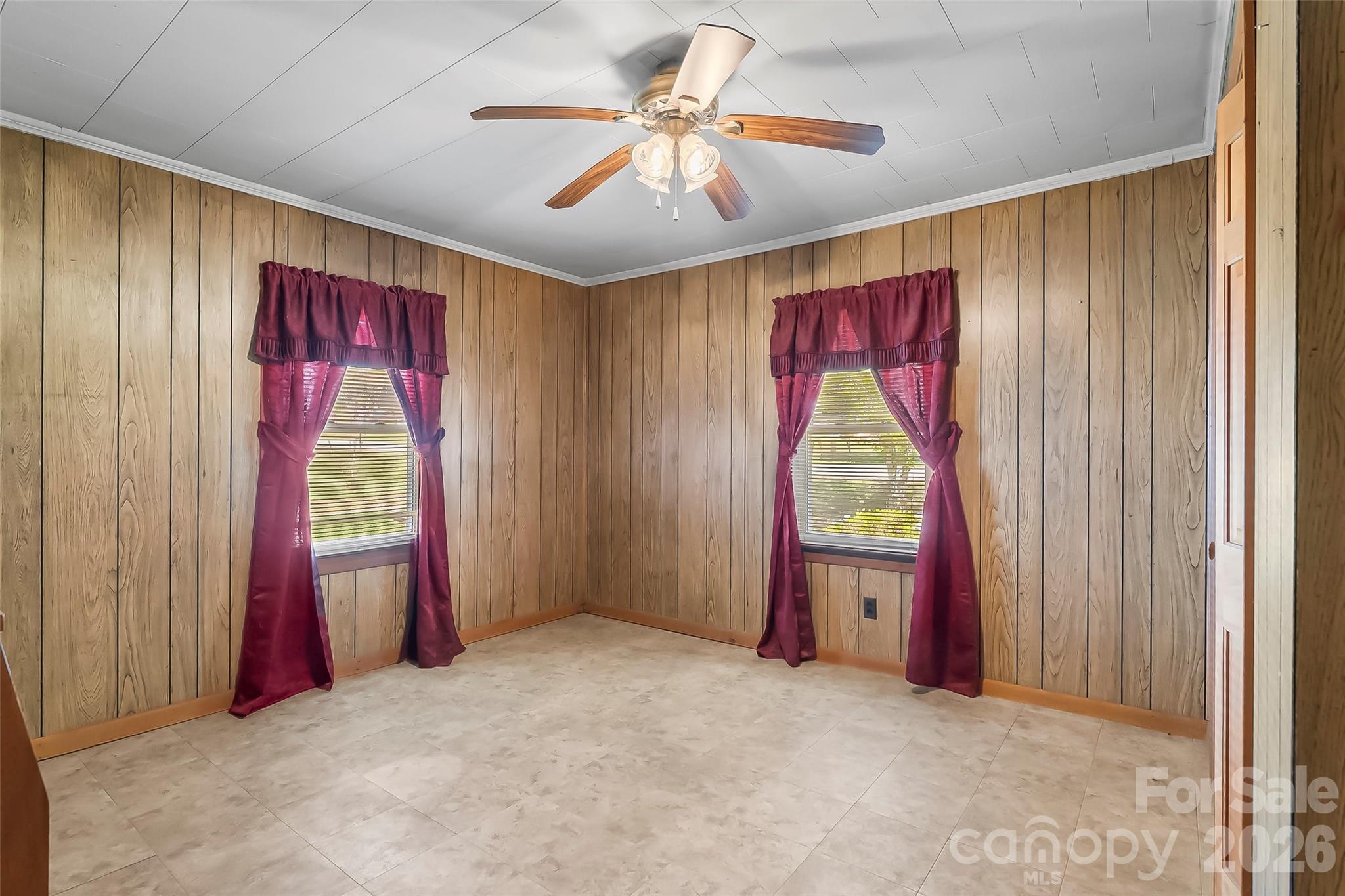 428 Melrose Street Southwest Lenoir, NC 28645 - Photo 16 of 34 a view of a room with window and ceiling fan