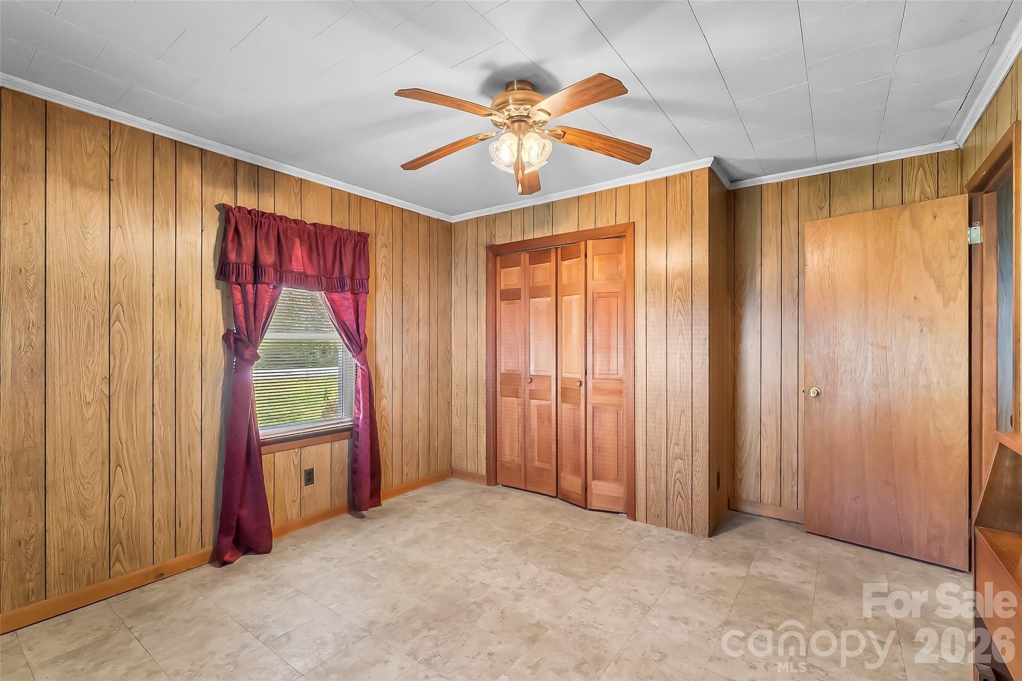 428 Melrose Street Southwest Lenoir, NC 28645 - Photo 17 of 34 a very nice looking bedroom with a large bed and a chandelier fan