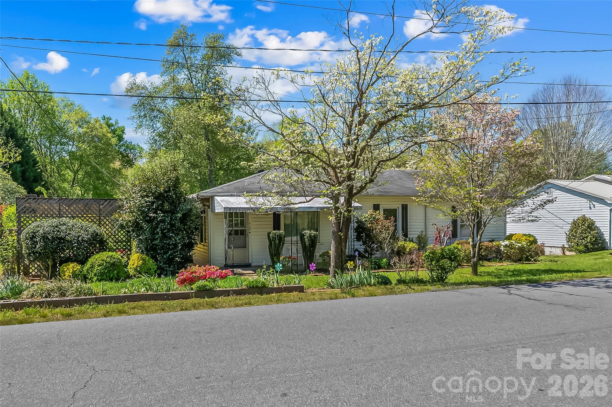 428 Melrose Street Southwest Lenoir, NC 28645 - Photo 27 of 34 a front view of a house with a garden