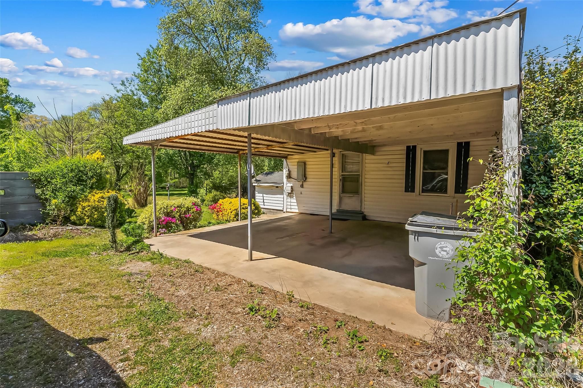 428 Melrose Street Southwest Lenoir, NC 28645 - Photo 28 of 34 a view of a house with backyard and sitting area
