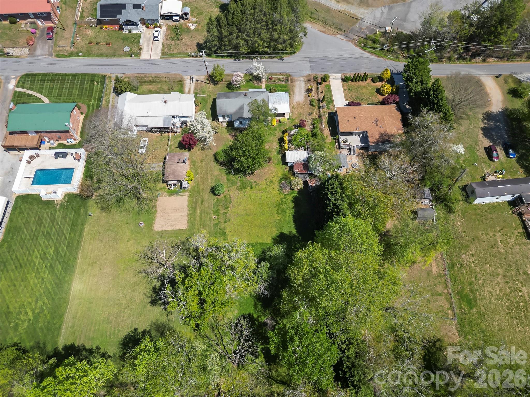 428 Melrose Street Southwest Lenoir, NC 28645 - Photo 30 of 34 an aerial view of residential houses with outdoor space and parking