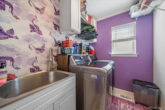 a room with a sink and cabinets