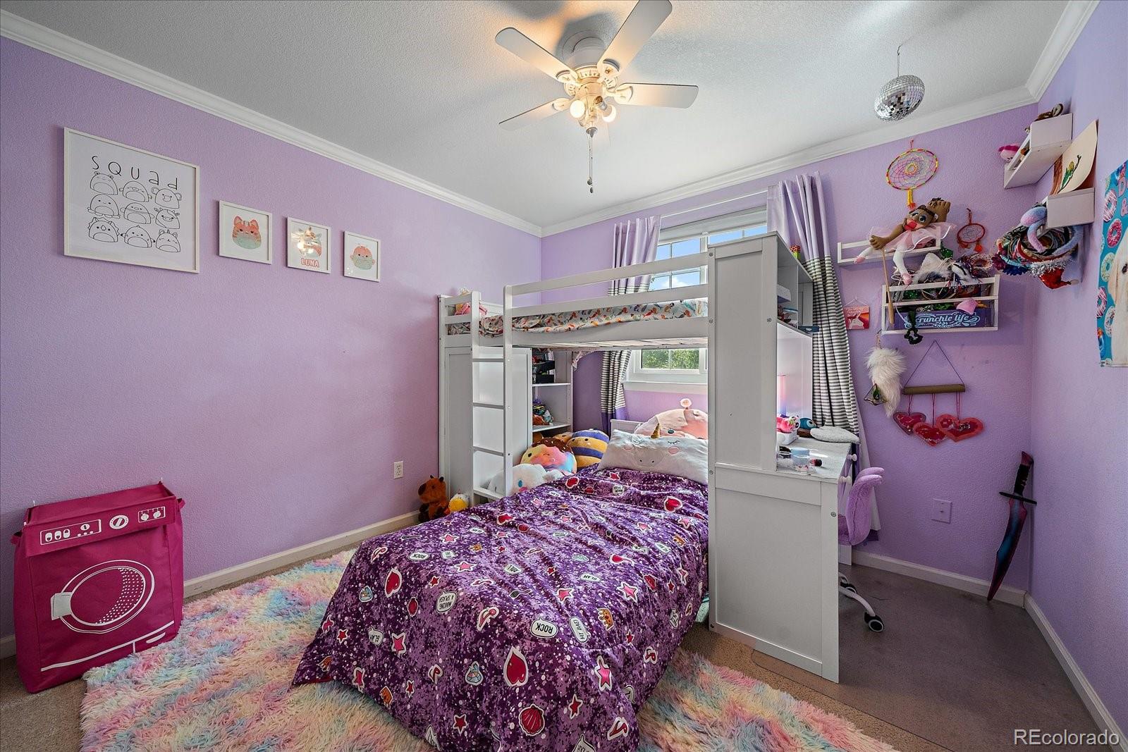 22379 East Dorado Avenue Aurora, CO 80015 - Photo 20 of 30 a bedroom with a bed and a window