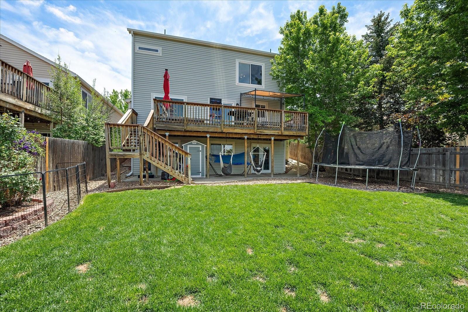 22379 East Dorado Avenue Aurora, CO 80015 - Photo 30 of 30 a view of house with a backyard and a slide