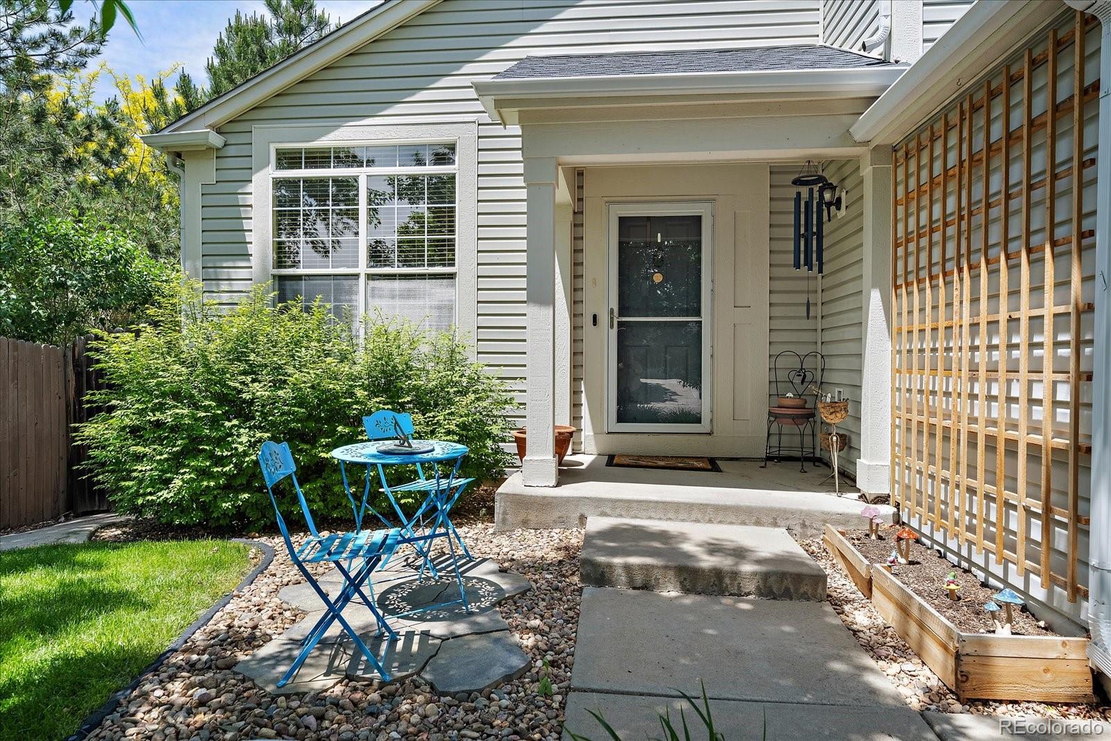22379 East Dorado Avenue Aurora, CO 80015 - Photo 3 of 30 a view of a chair and table in backyard of the house