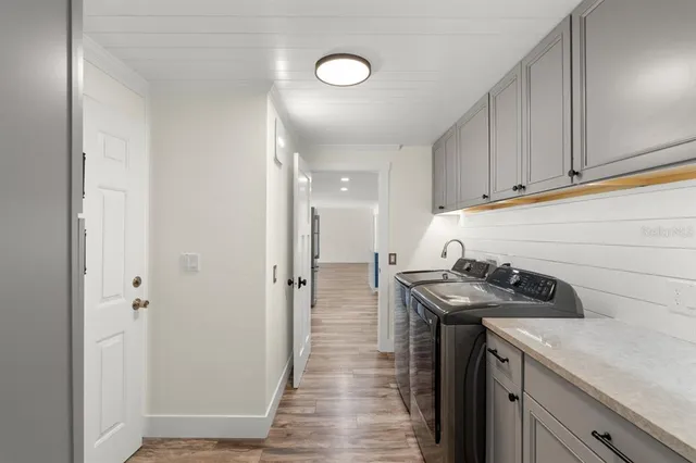 an empty room with a window and a ceiling fan