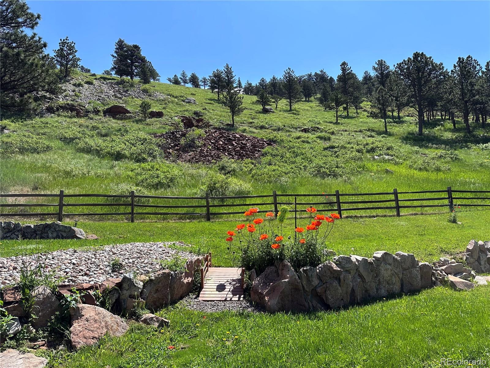 5384 Olde Stage Road Boulder, CO 80302 - Photo 14 of 49 a view of a garden with a swimming pool