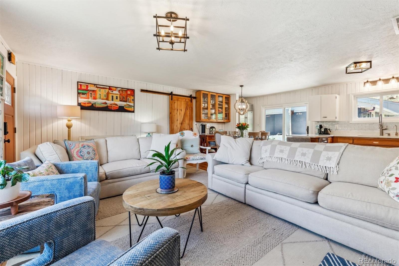 5384 Olde Stage Road Boulder, CO 80302 - Photo 21 of 49 a living room with furniture kitchen view and a potted plant