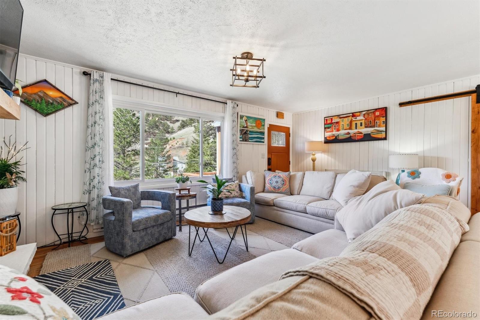 5384 Olde Stage Road Boulder, CO 80302 - Photo 22 of 49 a living room with furniture and a large window