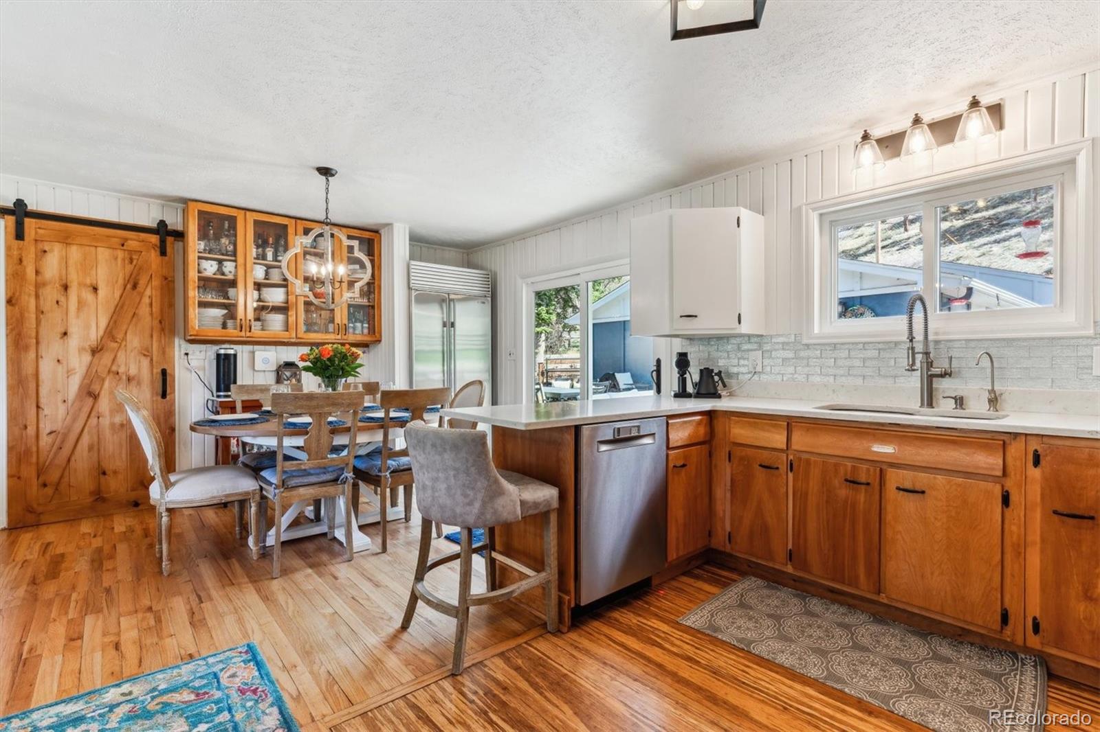 5384 Olde Stage Road Boulder, CO 80302 - Photo 25 of 49 a large kitchen with lots of counter and chairs