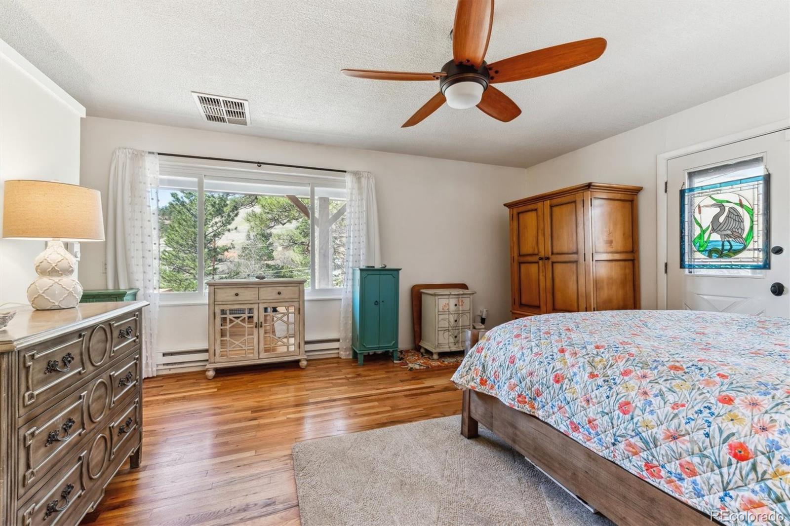 5384 Olde Stage Road Boulder, CO 80302 - Photo 29 of 49 a bedroom with a bed dresser and a window