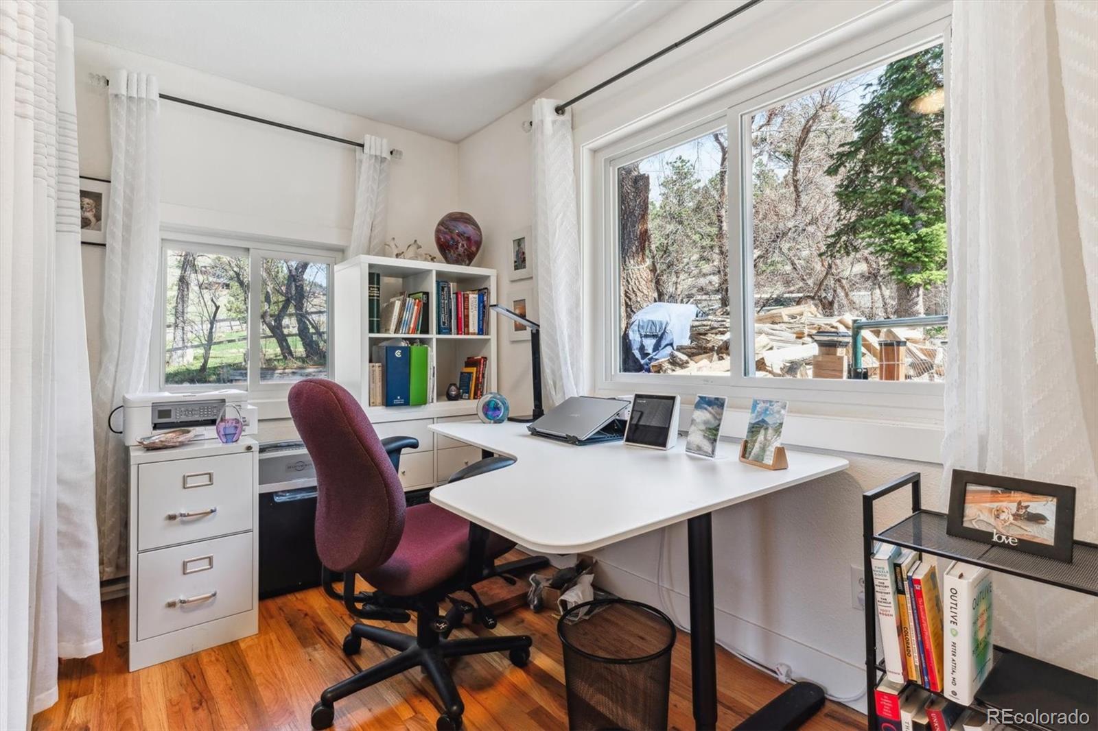 5384 Olde Stage Road Boulder, CO 80302 - Photo 30 of 49 a view of a workspace with furniture and a window