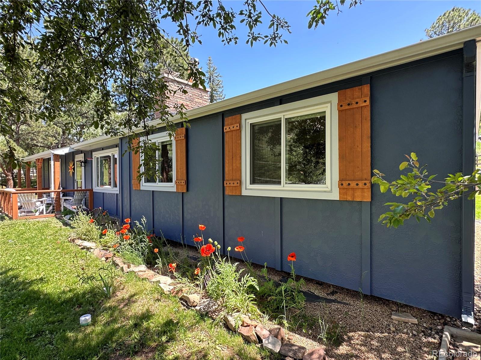 5384 Olde Stage Road Boulder, CO 80302 - Photo 3 of 49 a front view of a house with a yard