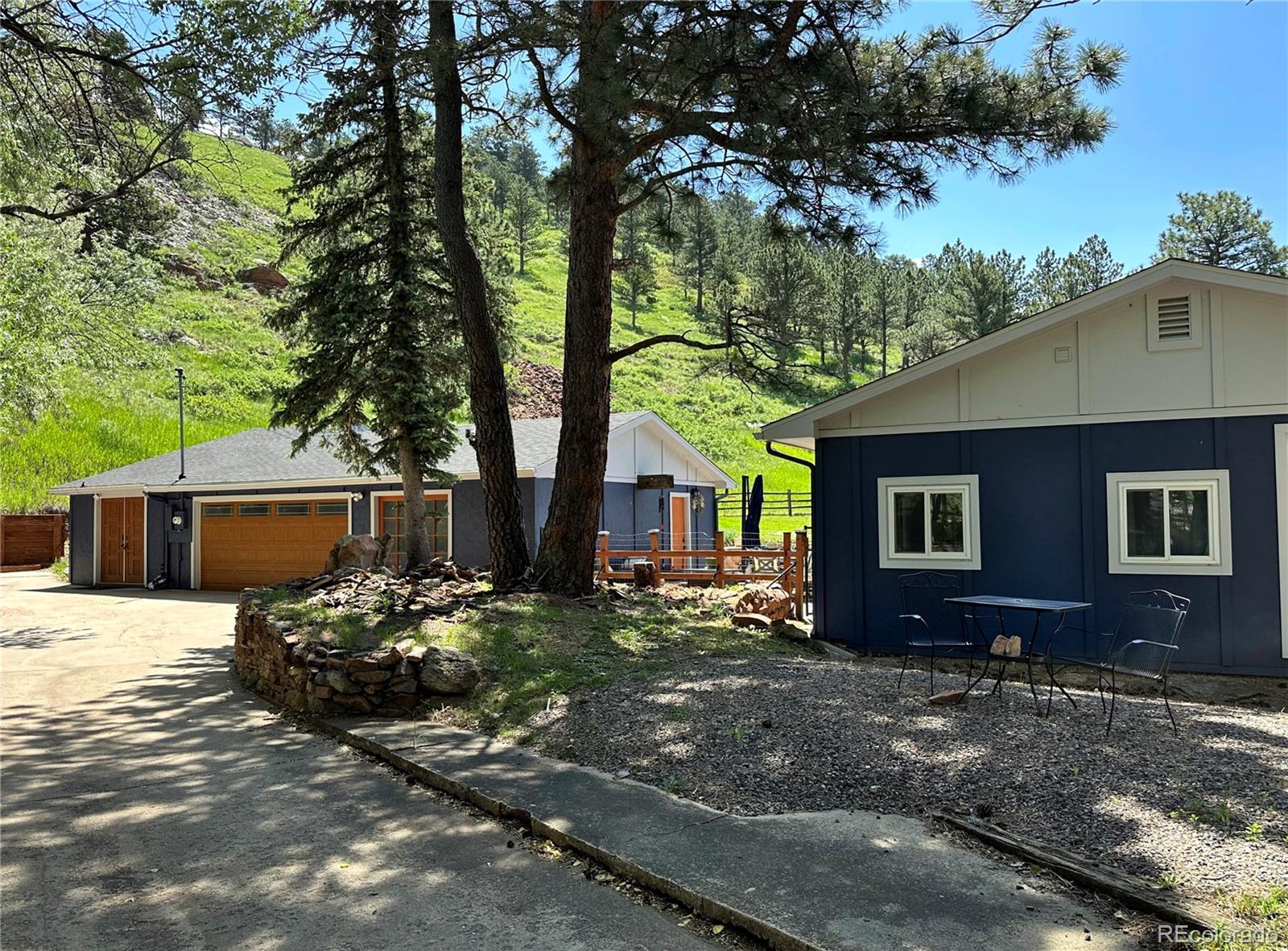 5384 Olde Stage Road Boulder, CO 80302 - Photo 5 of 49 a front view of a house with garden