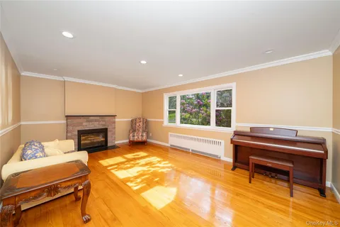 a living room with furniture fireplace and a table