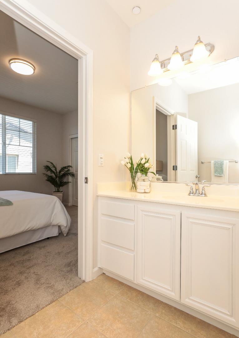 1756 Snell Place Milpitas, CA 95035 - Photo 12 of 22 a bathroom with a sink and a mirror