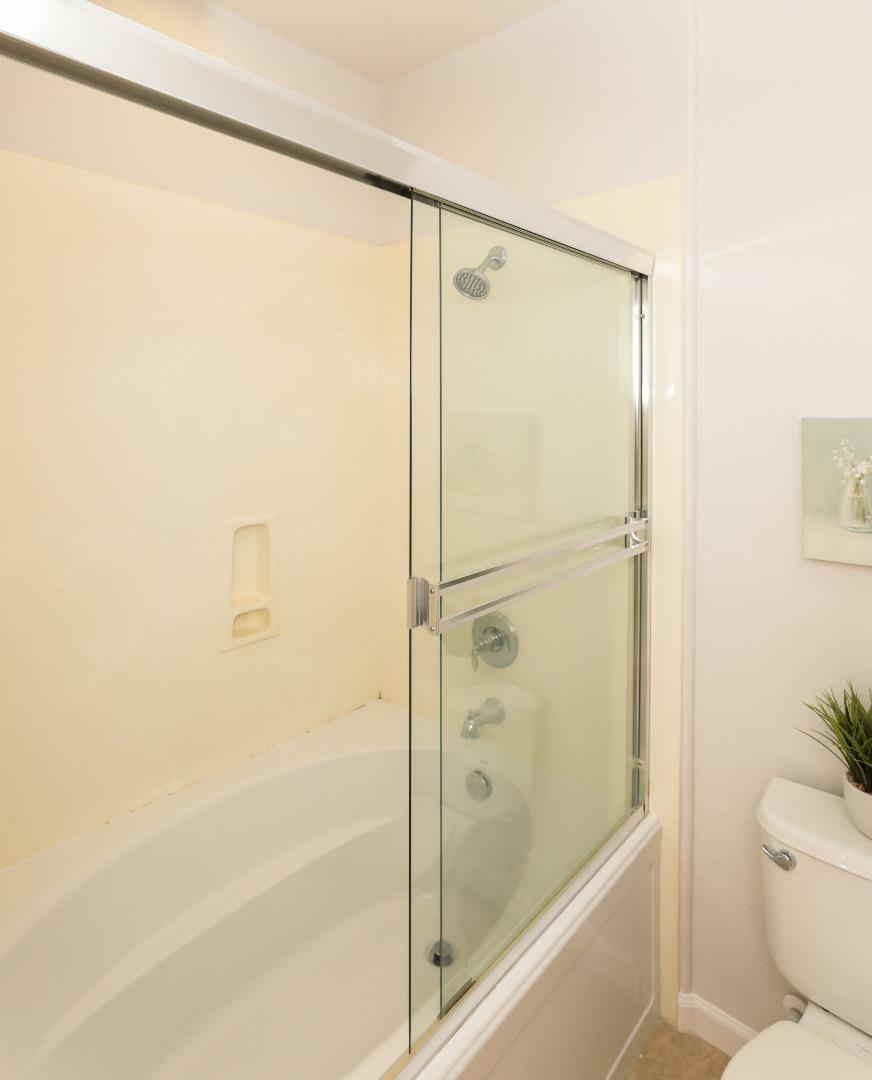 1756 Snell Place Milpitas, CA 95035 - Photo 13 of 22 a bathroom with a shower and a toilet