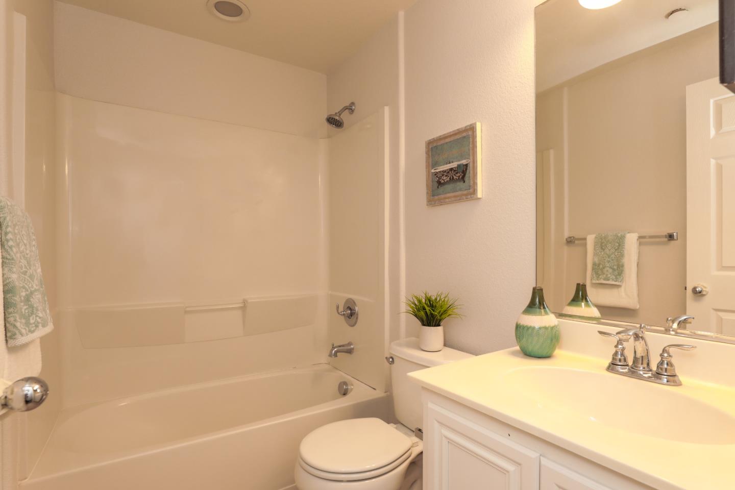 1756 Snell Place Milpitas, CA 95035 - Photo 7 of 22 a bathroom with a granite countertop sink toilet and shower