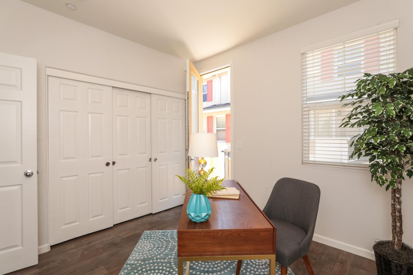 1756 Snell Place Milpitas, CA 95035 - Photo 9 of 22 a view of a workspace with furniture and a potted plant