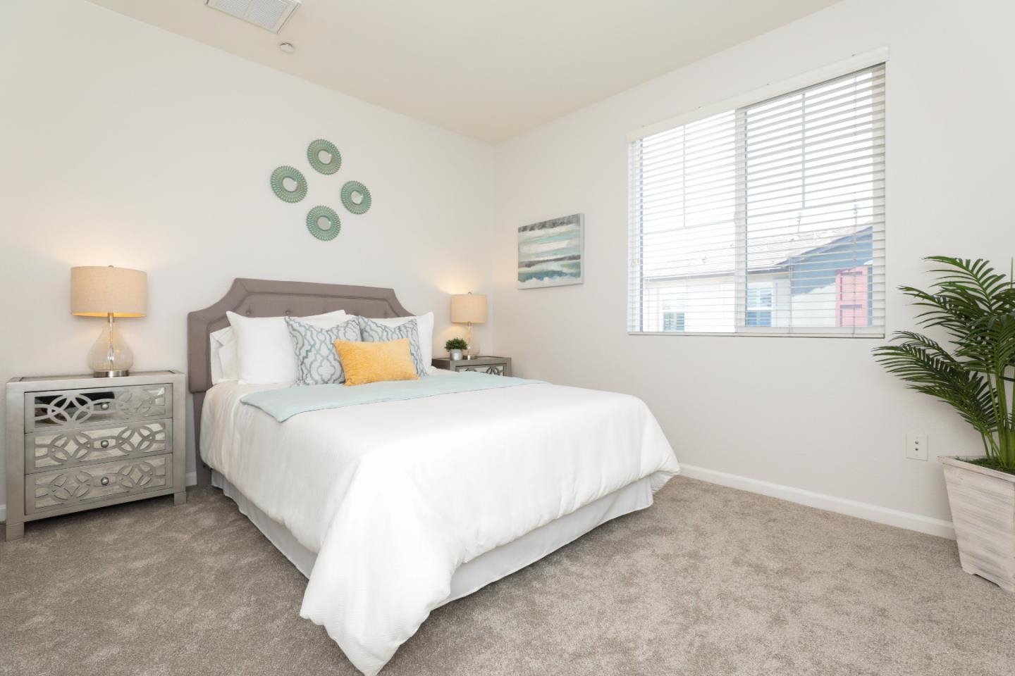 1756 Snell Place Milpitas, CA 95035 - Photo 10 of 22 a bedroom with a bed and a window