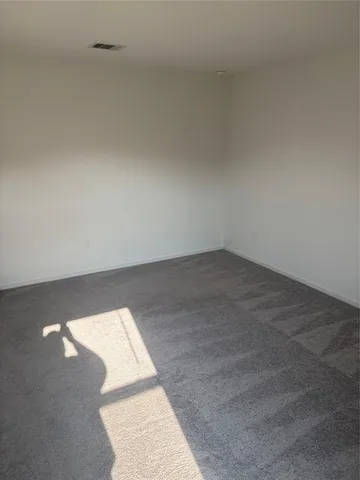 an empty room with a book shelf