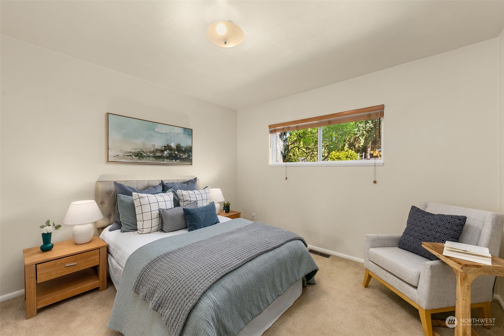 8123 28th Avenue Southwest Seattle, WA 98126 - Photo 12 of 31 a bedroom with a bed and wooden floor