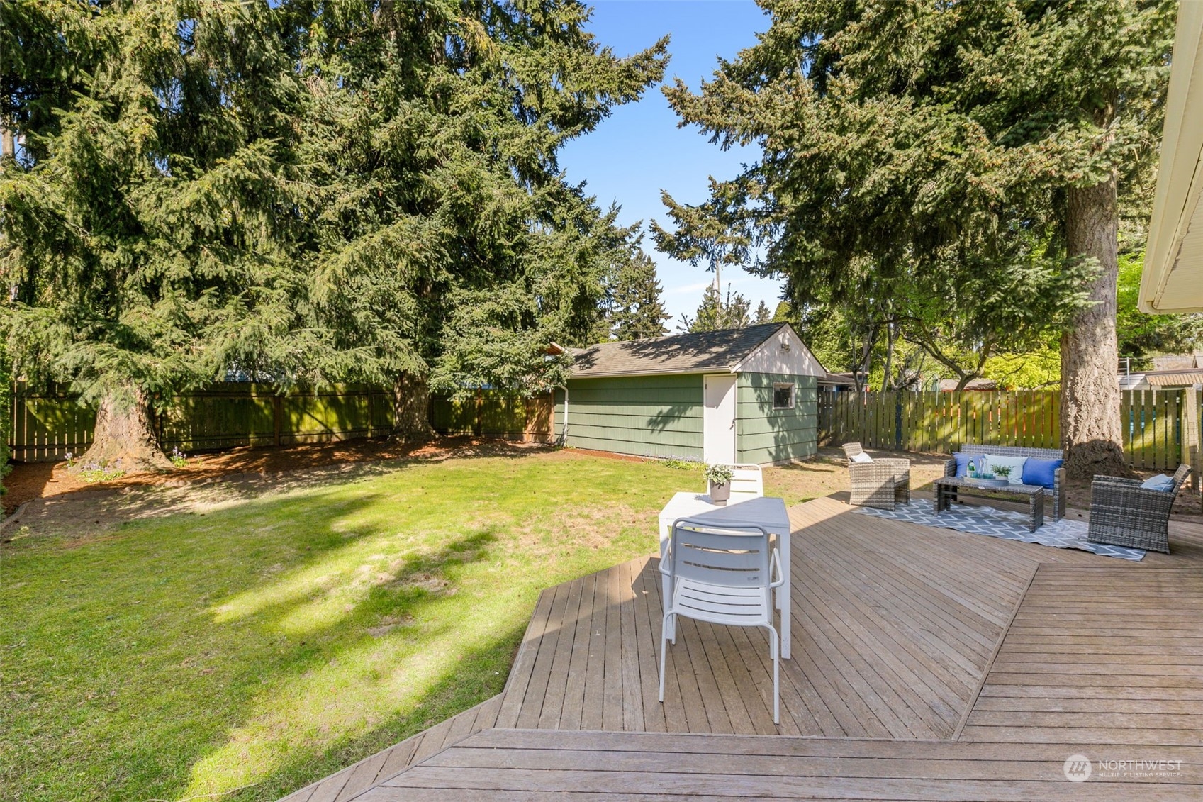 8123 28th Avenue Southwest Seattle, WA 98126 - Photo 21 of 31 a view of a house with swimming pool and sitting area