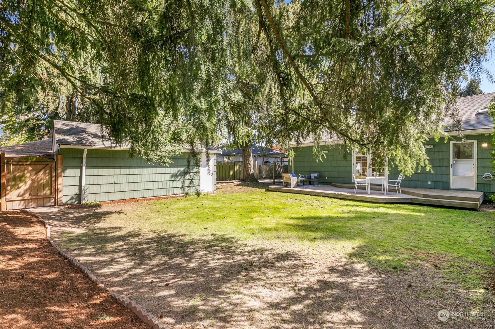 8123 28th Avenue Southwest Seattle, WA 98126 - Photo 26 of 31 a view of swimming pool with lawn chairs and plants