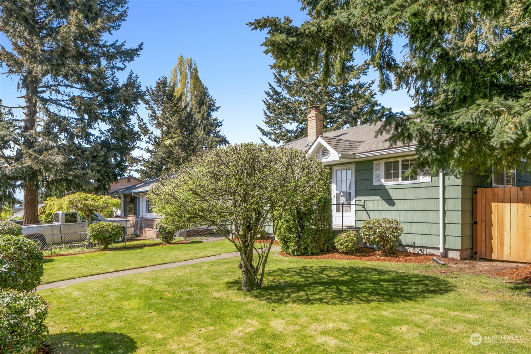 8123 28th Avenue Southwest Seattle, WA 98126 - Photo 28 of 31 a view of a house with a backyard