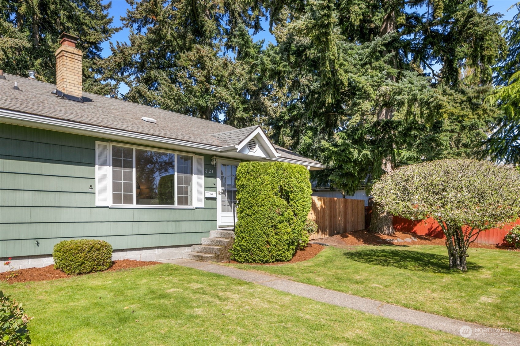8123 28th Avenue Southwest Seattle, WA 98126 - Photo 30 of 31 a view of house with backyard outdoor seating area