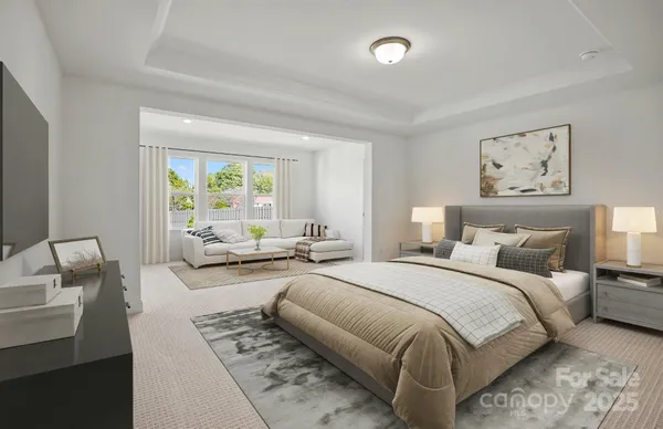 a bedroom with a large bed and a couch