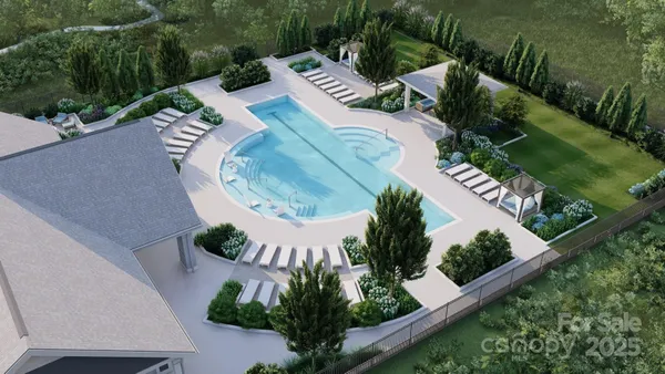 an aerial view of a house with garden space and street view