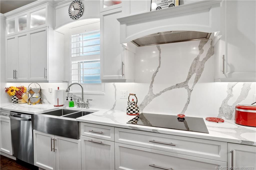 519 Southwest Ocean Boulevard Stuart, FL 34994 - Photo 12 of 27 a kitchen with a sink and cabinets