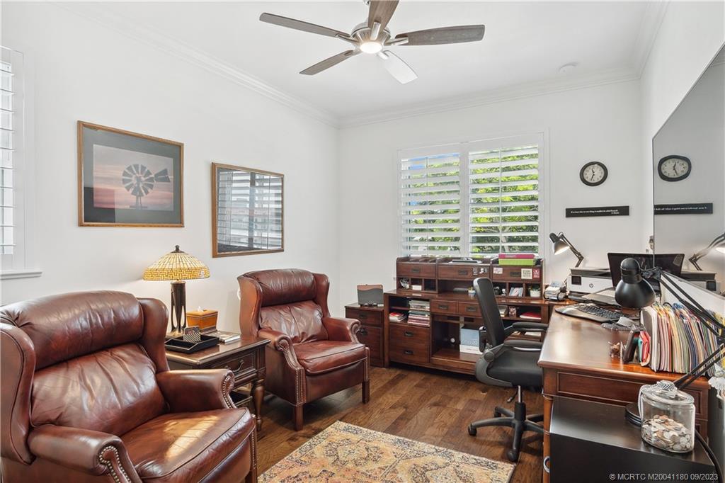519 Southwest Ocean Boulevard Stuart, FL 34994 - Photo 21 of 27 a living room with furniture and a large window