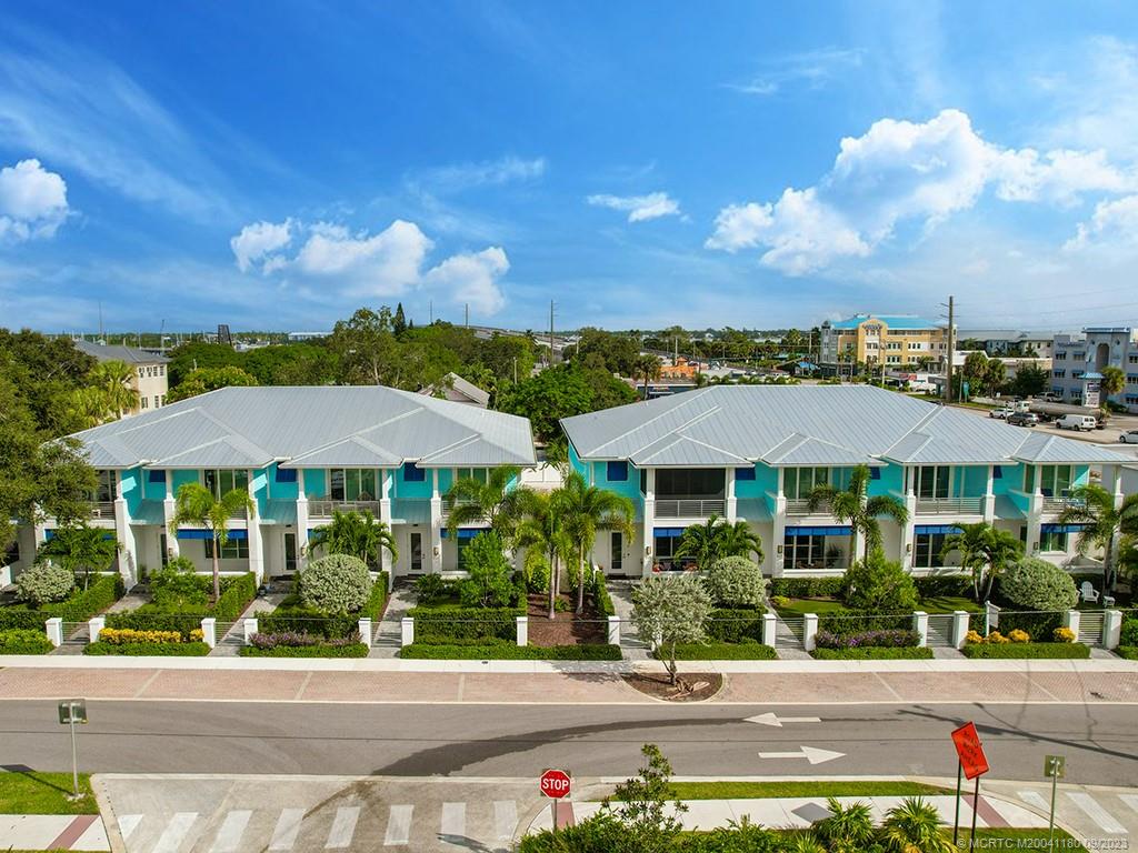 519 Southwest Ocean Boulevard Stuart, FL 34994 - Photo 26 of 27 a front view of a house with a yard and street