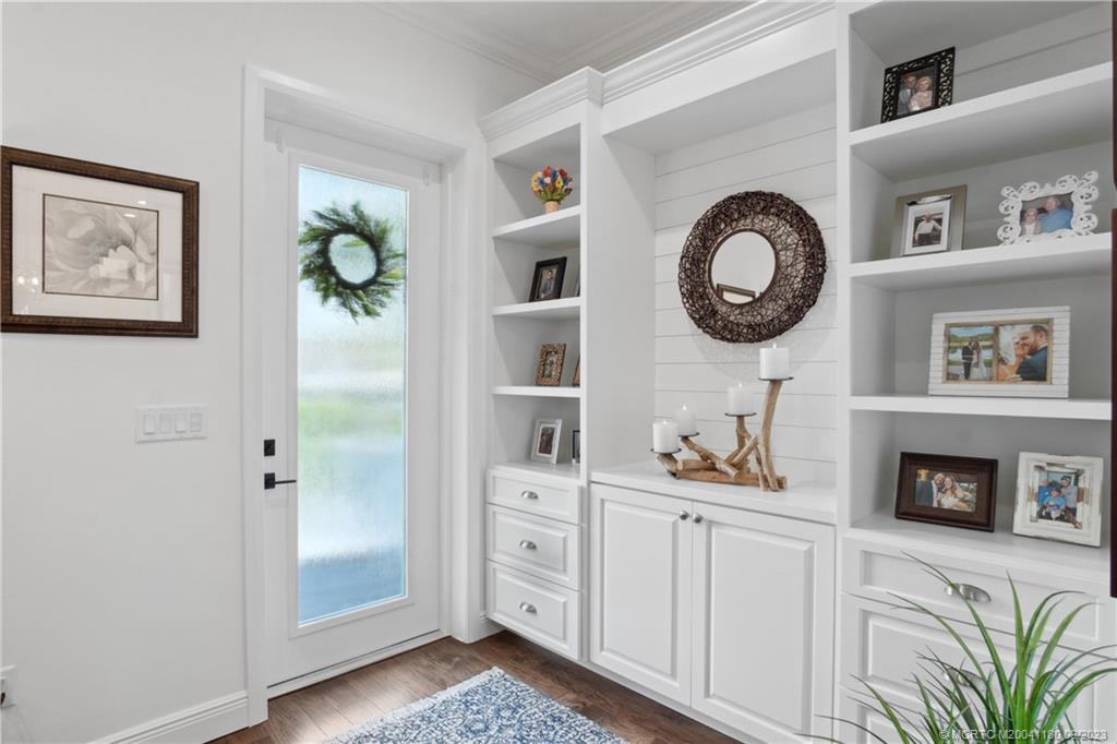 519 Southwest Ocean Boulevard Stuart, FL 34994 - Photo 4 of 27 a front view of a house with entryway and wooden floor