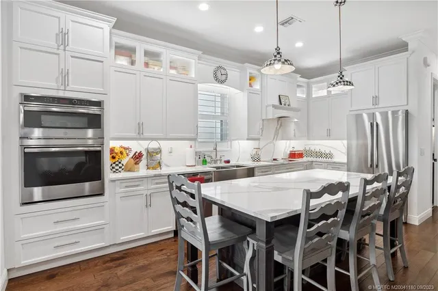 a kitchen with a table and chairs in it