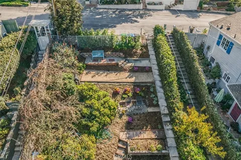 an aerial view of a house with outdoor space