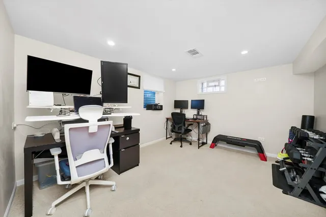 a view of a room with workspace and mirror