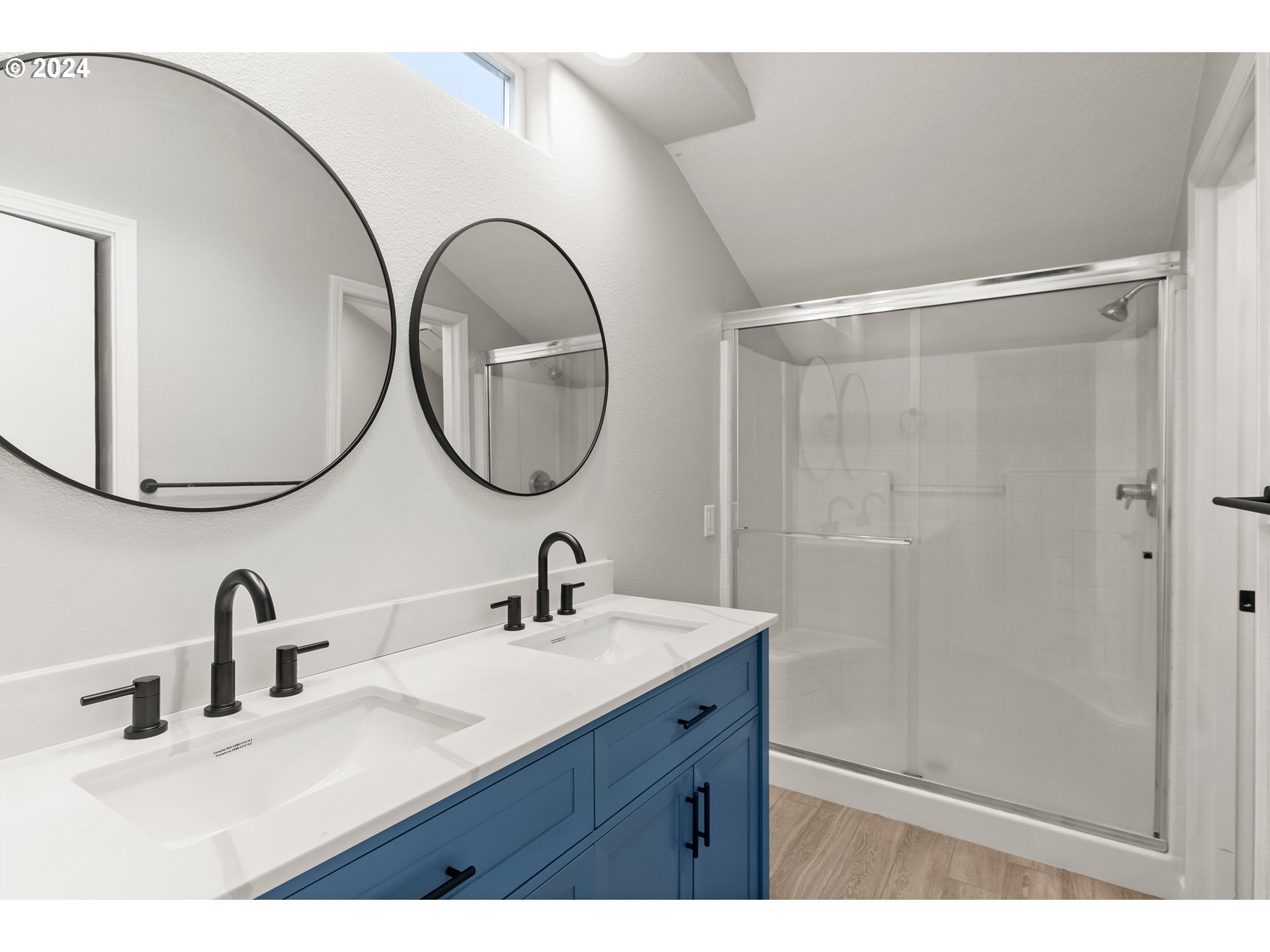 216 Southwest Sutherland Way Beaverton, OR 97006 - Photo 11 of 19 a bathroom with a sink and a mirror