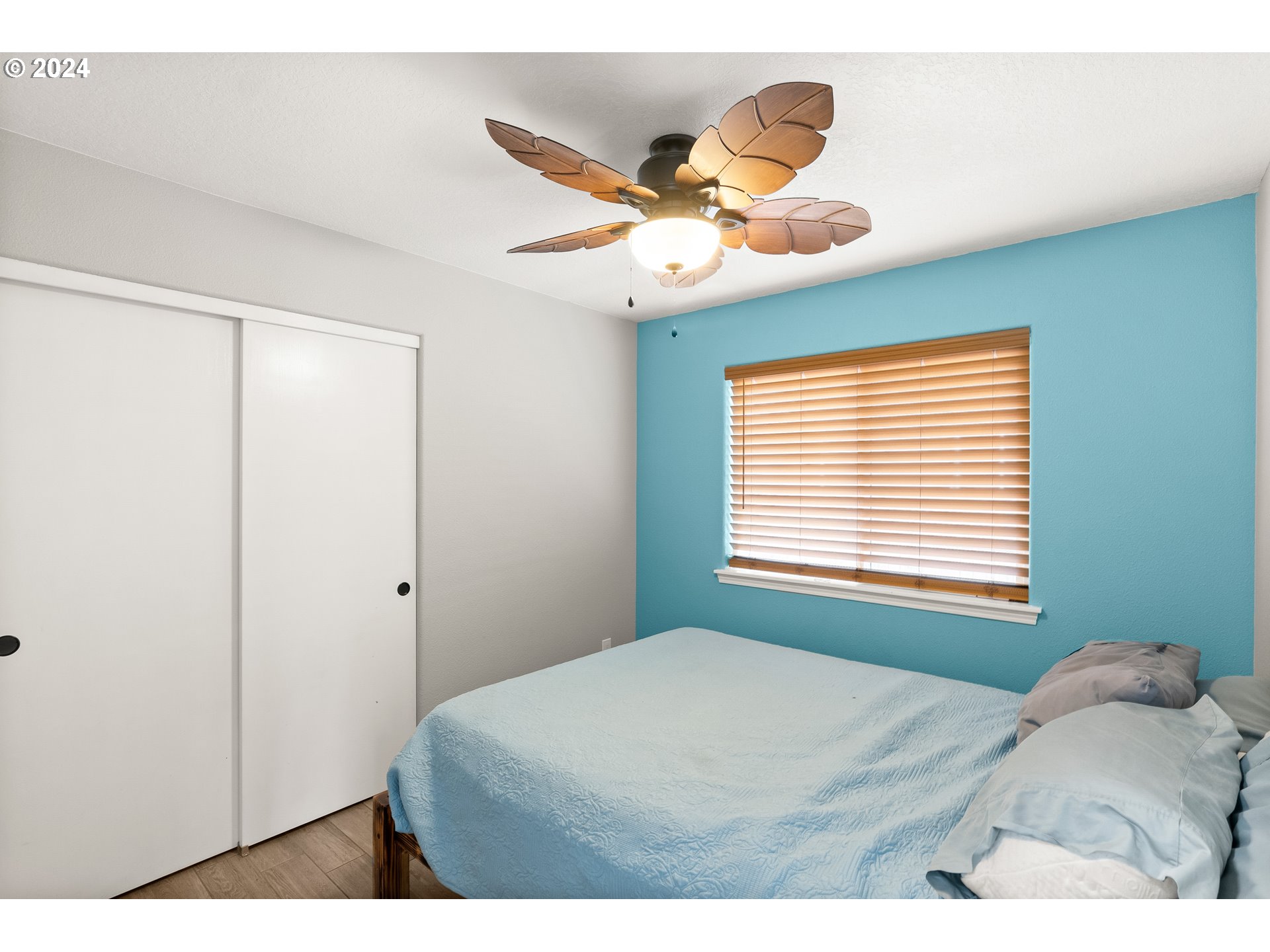 216 Southwest Sutherland Way Beaverton, OR 97006 - Photo 15 of 19 a bedroom with a bed and a window