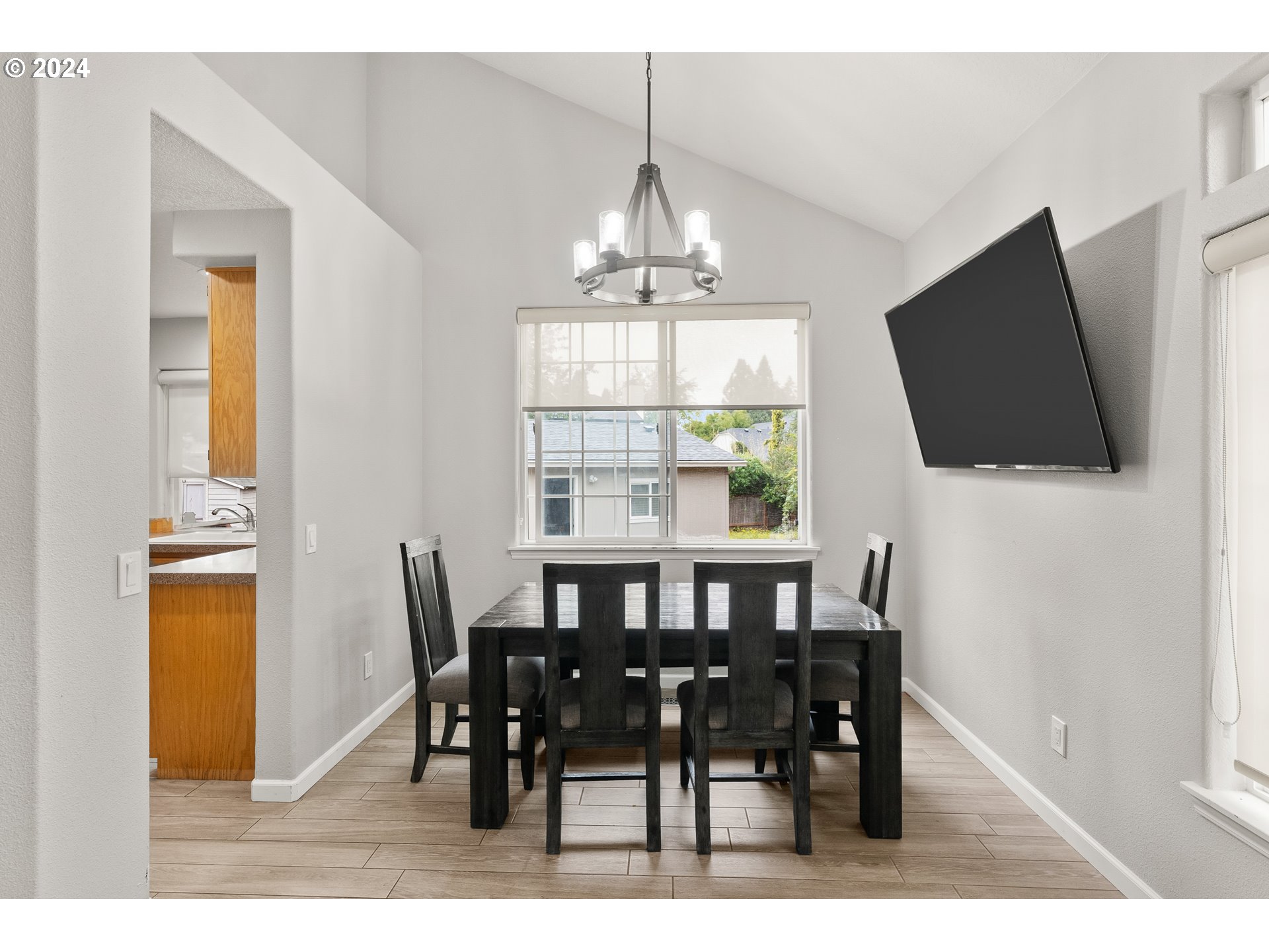 216 Southwest Sutherland Way Beaverton, OR 97006 - Photo 6 of 19 a view of a dining room with furniture window and wooden floor
